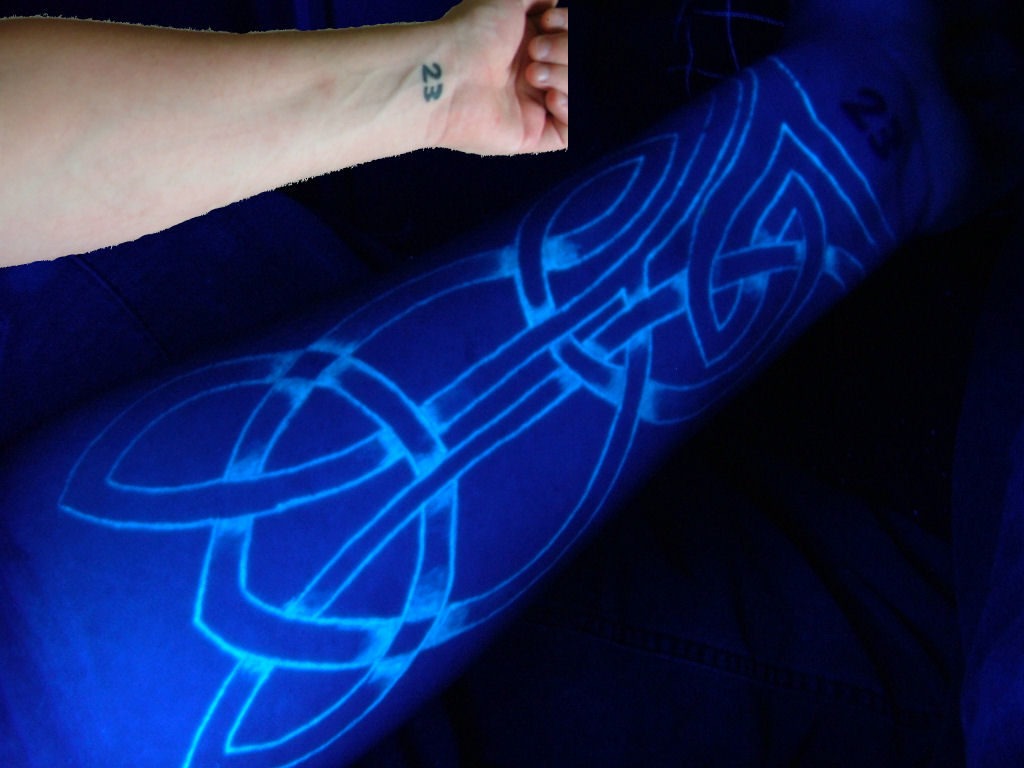 ultraviolet arm tattoo